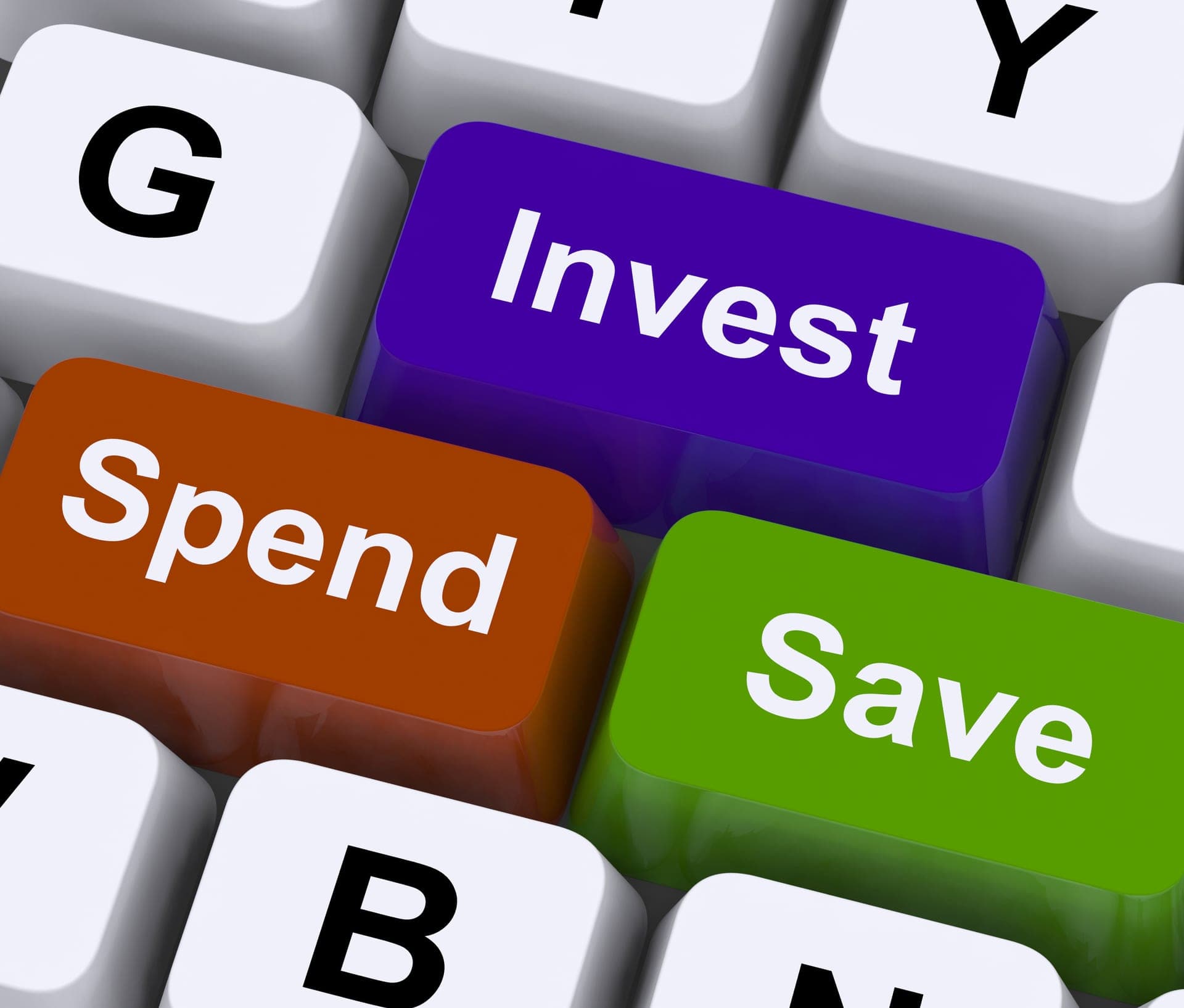 Keyboard with Save, Spend, and Invest keys representing budget choices