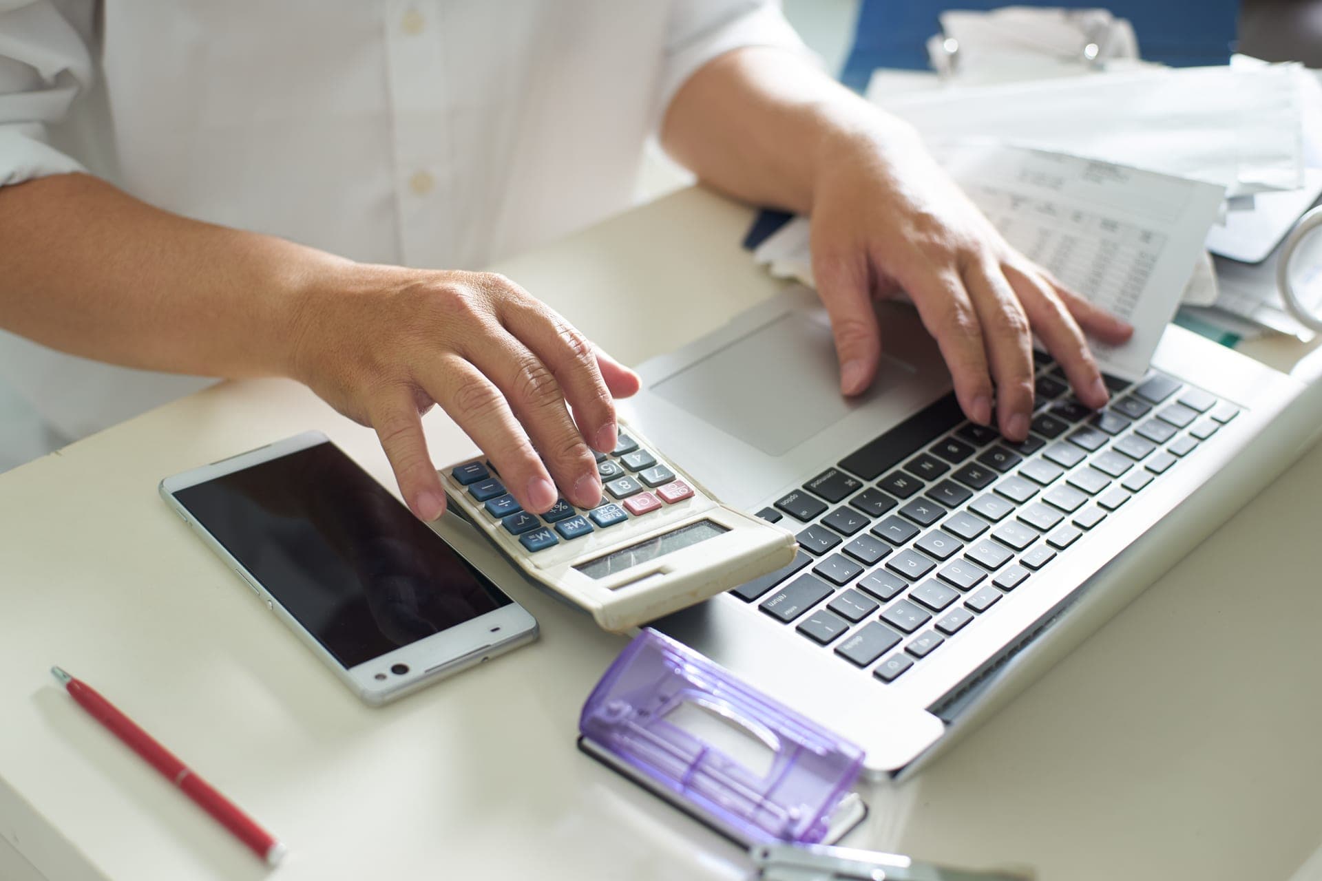 Business tax calculations with laptop