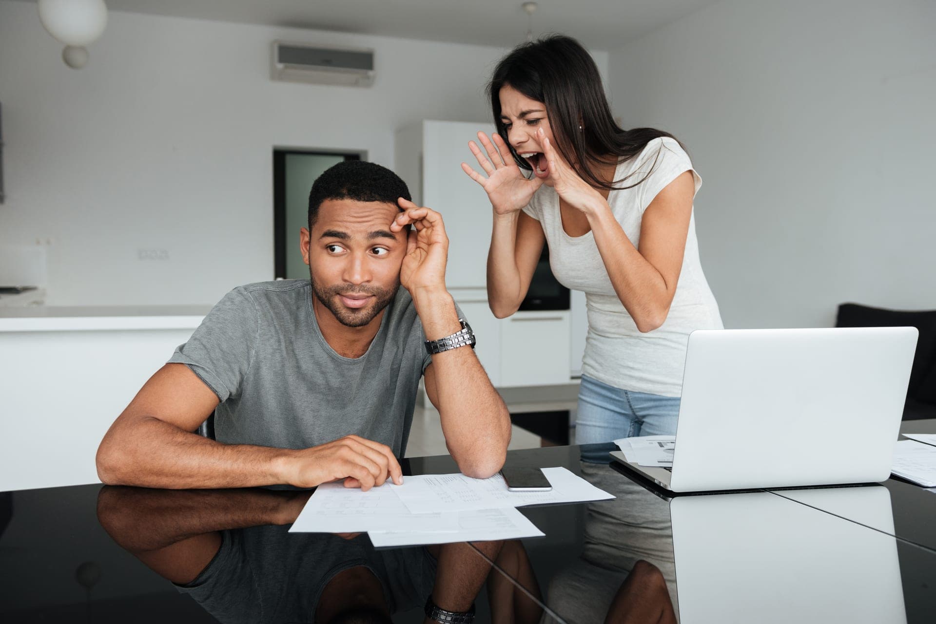 Couple discussing domestic bills at home