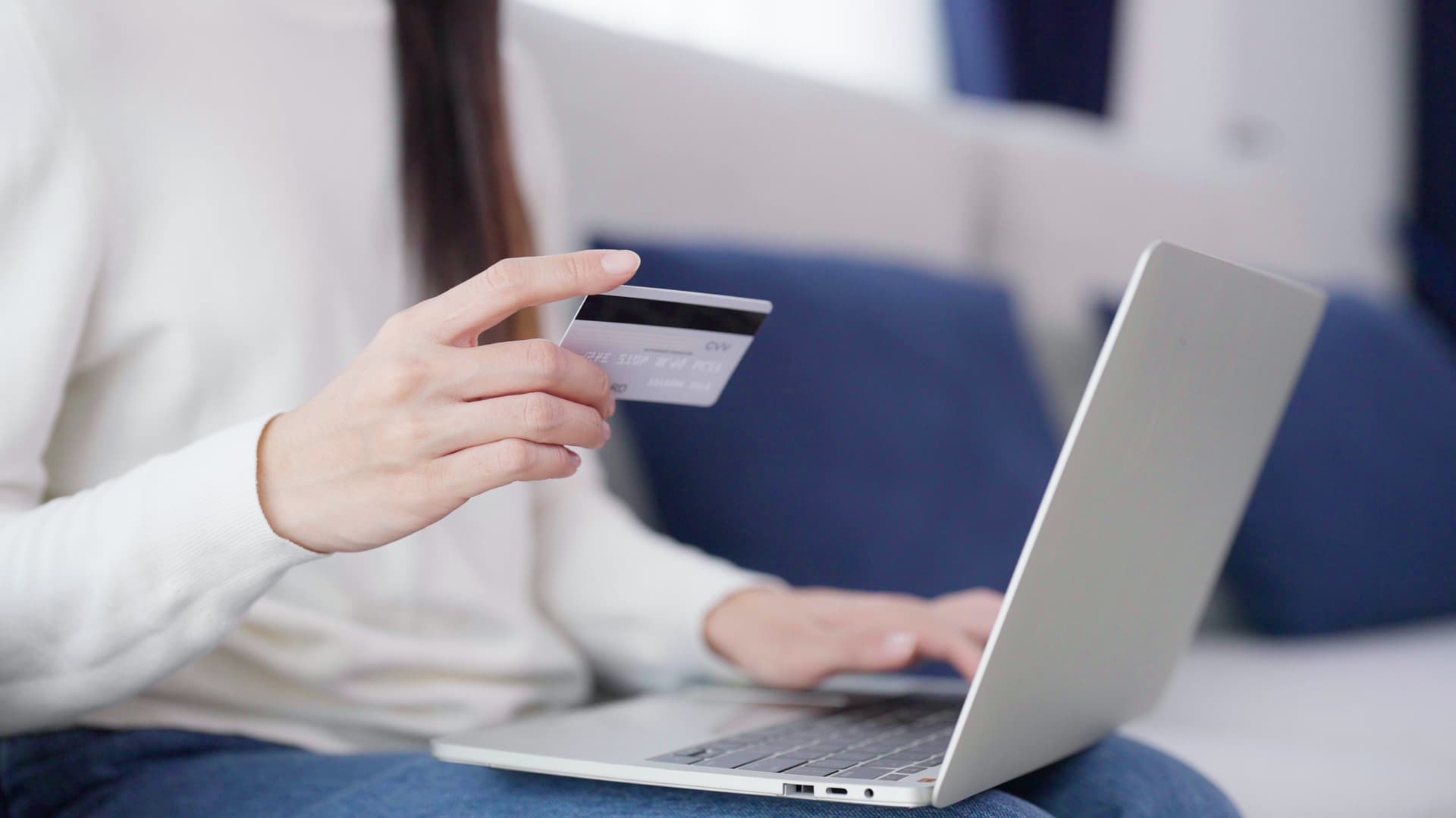 Young woman using smartphone for online banking payments