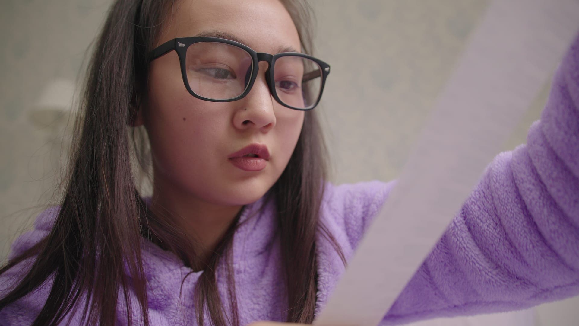 Woman reviewing tax documents carefully