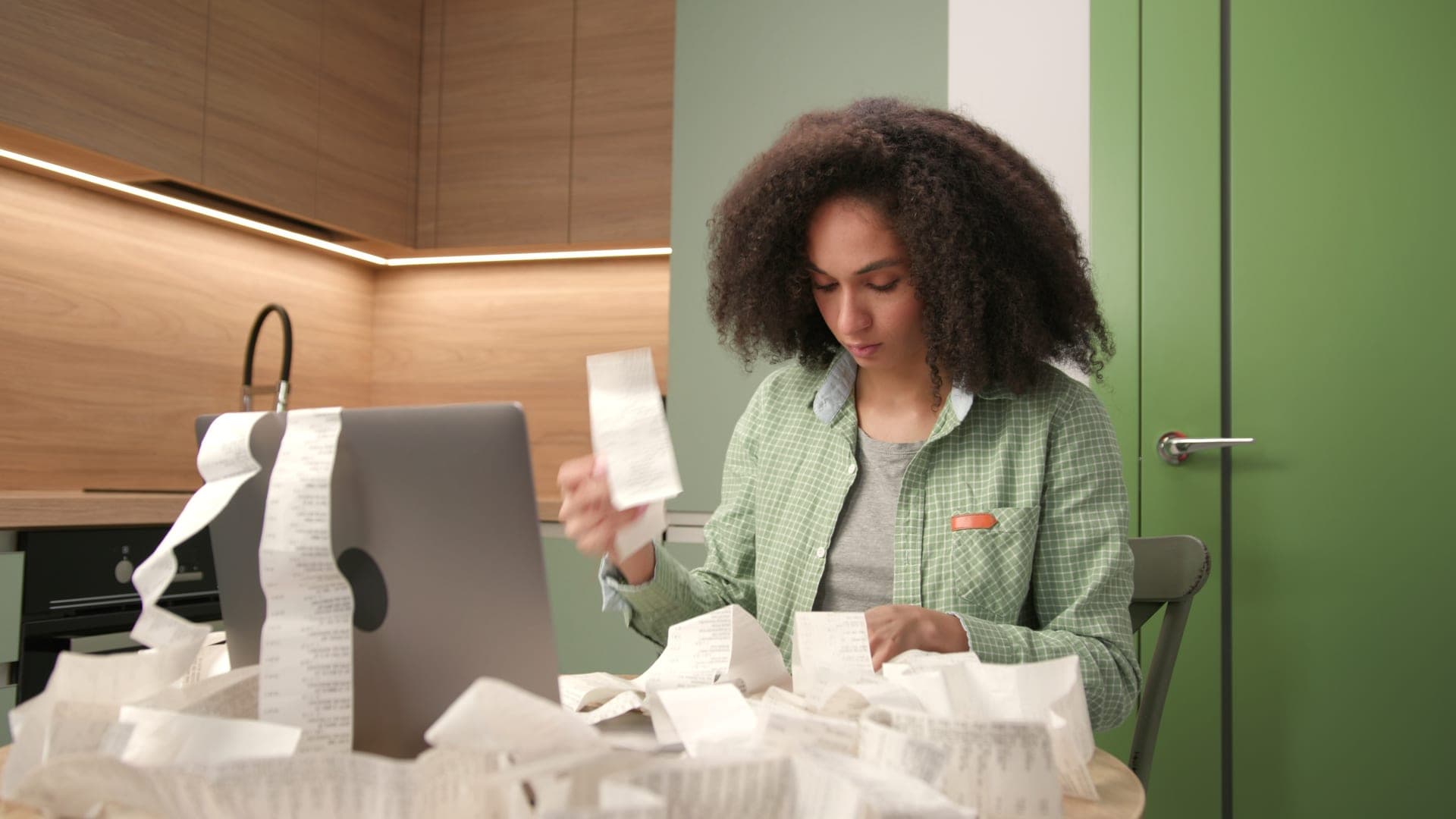 Woman managing irregular income and home finances